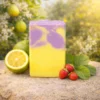 Bergamot Twist goat milk soap with bright yellow base and purple swirls with bergamot and strawberries