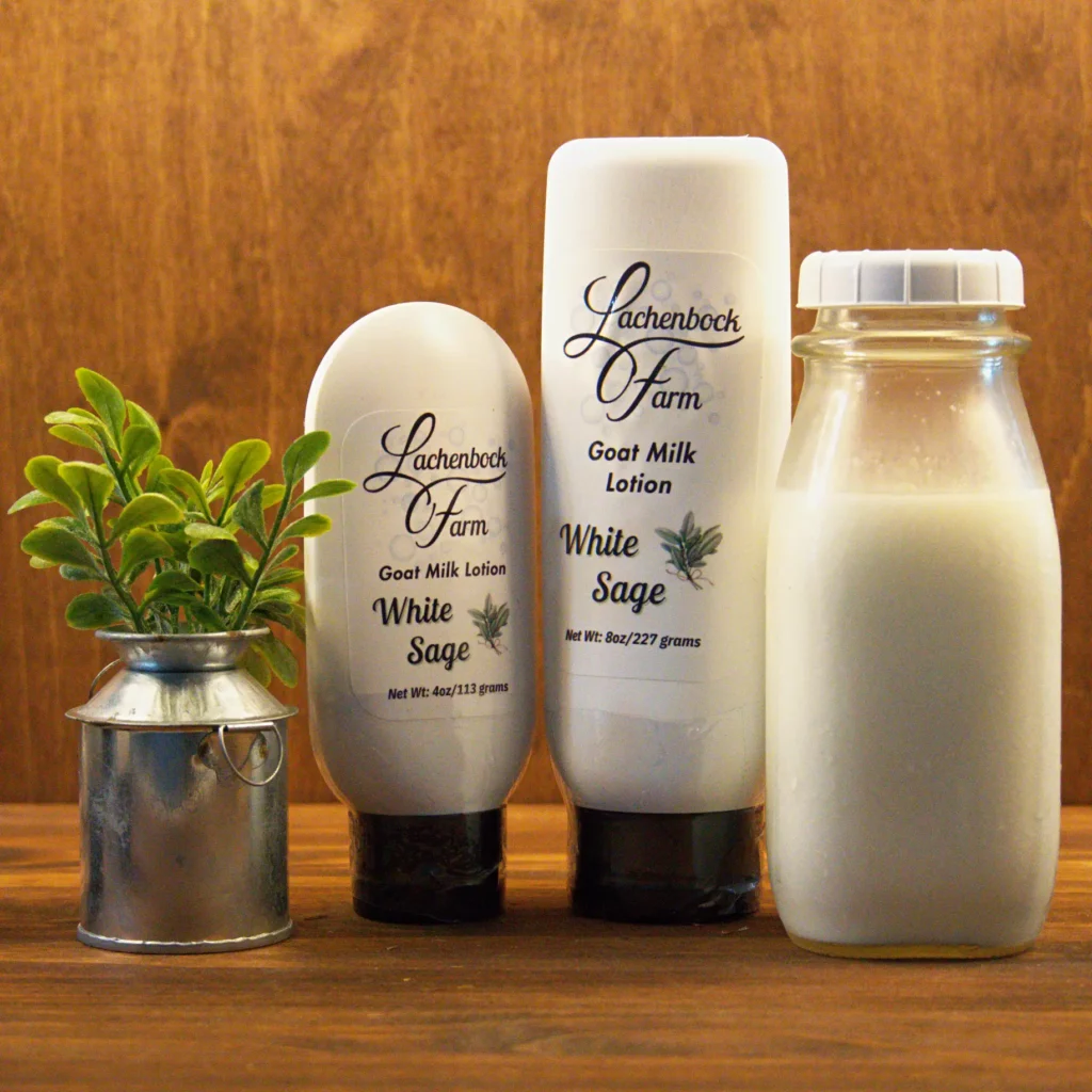 White Sage Goat Milk Lotion from Lachenbock Farm in 4 oz and 8 oz bottles, shown with a glass bottle of milk and rustic decor